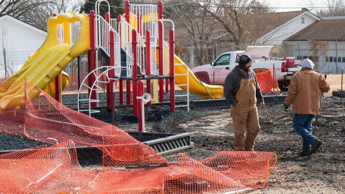 Wichita school services works to make the playground safe after Saturday’s arson at Adams Elementary. The extensive damage to the equipment was cleared up in time for the first recess Monday. (Jan. 9, 2017)