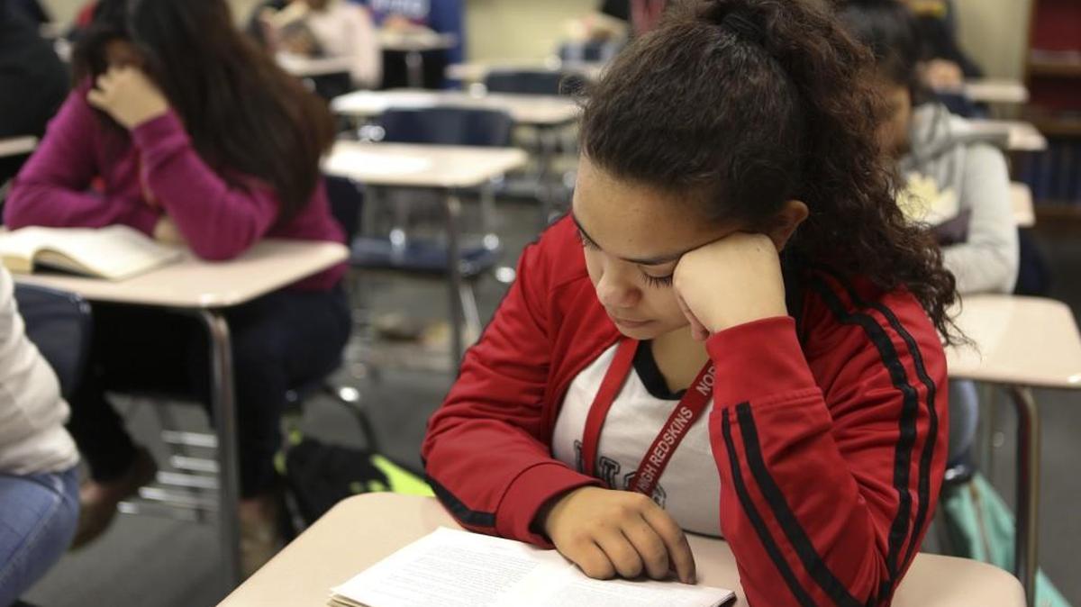 North High freshman Alejandra Hernandez reads during “Tower Time,” a time where the entire schools spends half the period reading. (January 26, 2017)
