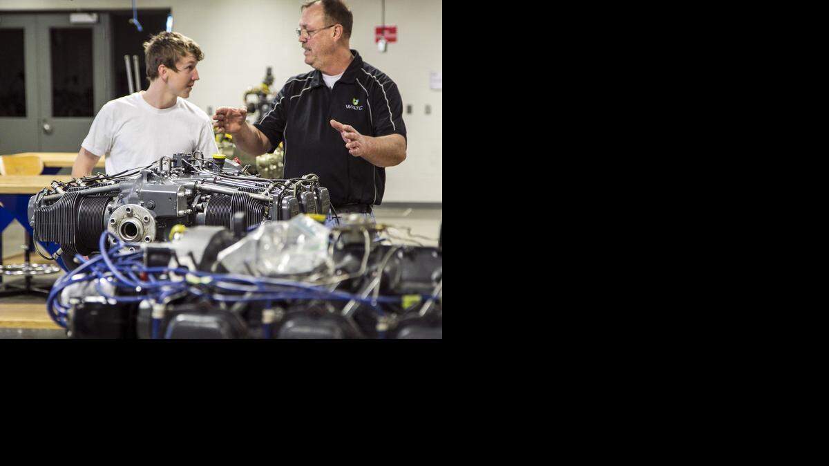 
Aircraft power plant student Blake Meier, left, and instructor Phil Taylor prepare for Meier's oral and practical exam at the National Center for Aviation Training, operated by the Wichita Area Technical College. (Feb. 13, 2015) 
