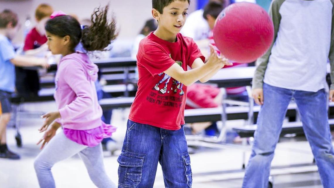 College Hill Elementary fourth-grader Avery Basinger plays four square Thursday while waiting for his parents to pick him up from the school’s latchkey program. A potential shutdown of schools on July 1 would mean no more summer latchkey program.