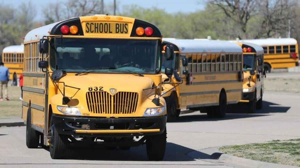 Buses filled with Stucky Middle School students leave school for the day. The Wichita school board is considering a proposal that would eliminate some rides for students that don’t meet the hazardous-route criteria. (March 24, 2016)