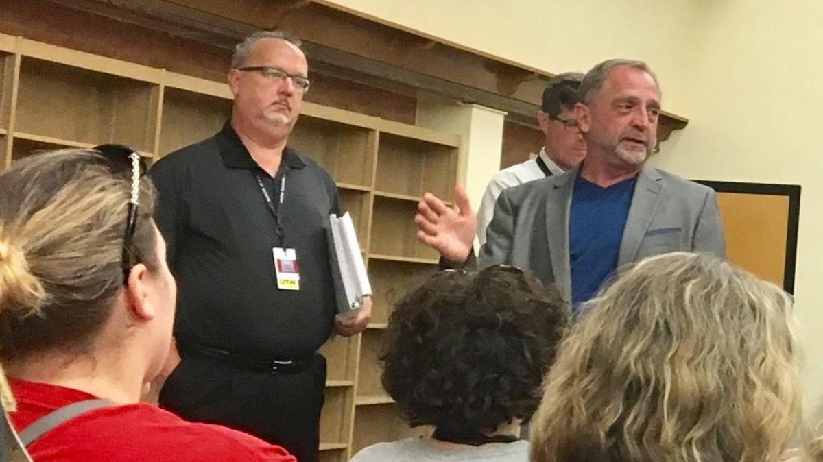 Steve Wentz, right, president of United Teachers of Wichita, and Keith Welty, a member of the union’s negotiating team, address teachers Wednesday. After a brief negotiation session, the district and union declared an impasse and will seek federal mediation to settle the contract.