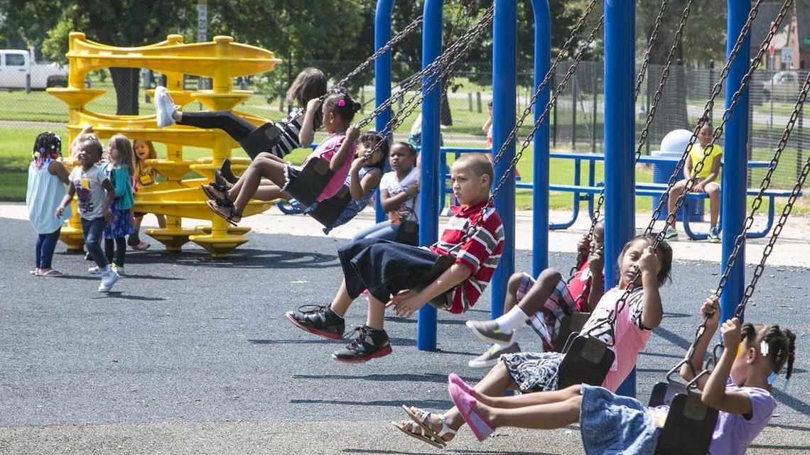 Linwood Elementary School students swing during recess after lunch. (Aug. 18, 2015)