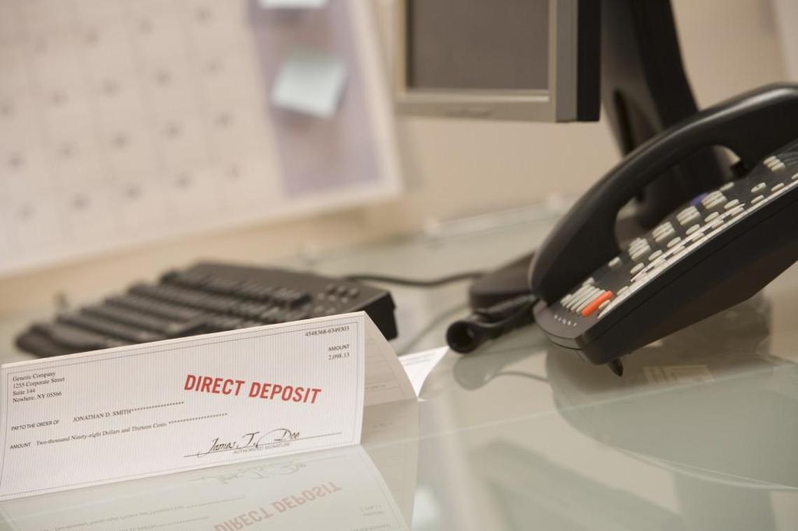 Photo illustration of a paycheck.