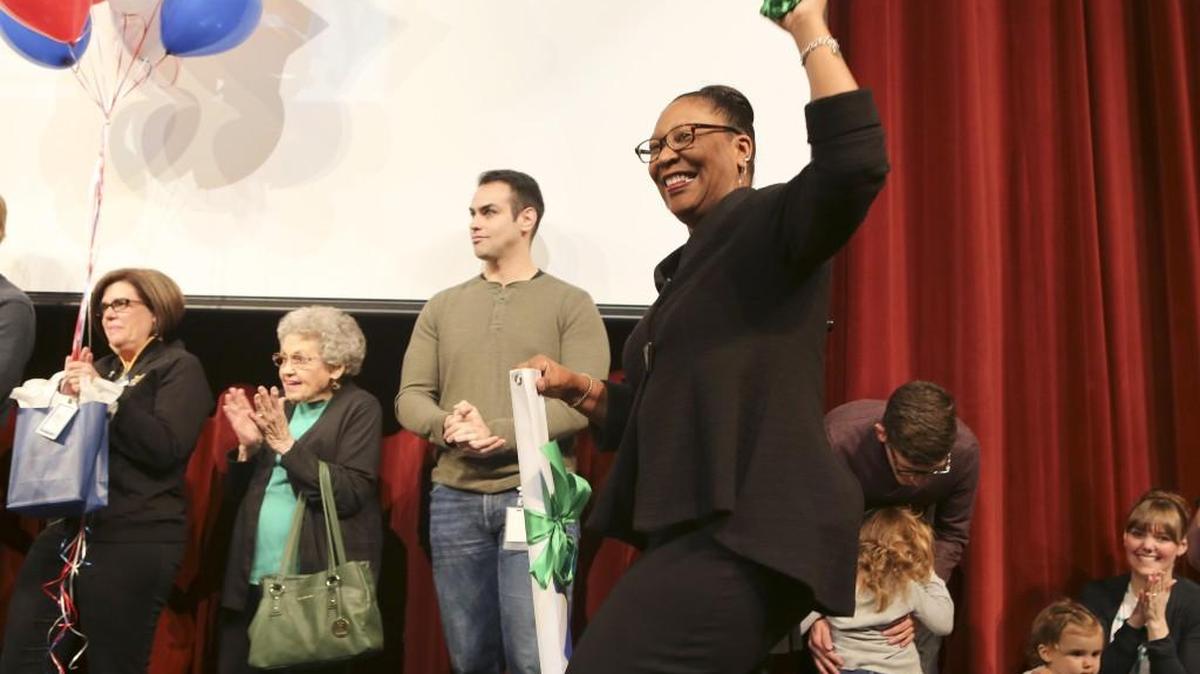 Alicia Thompson cheers during a ceremony last week honoring three distinguished classroom teachers at Christa McAuliffe Academy. Thompson will replace outgoing USD 259 superintendent John Allison. (Feb. 24, 2017)