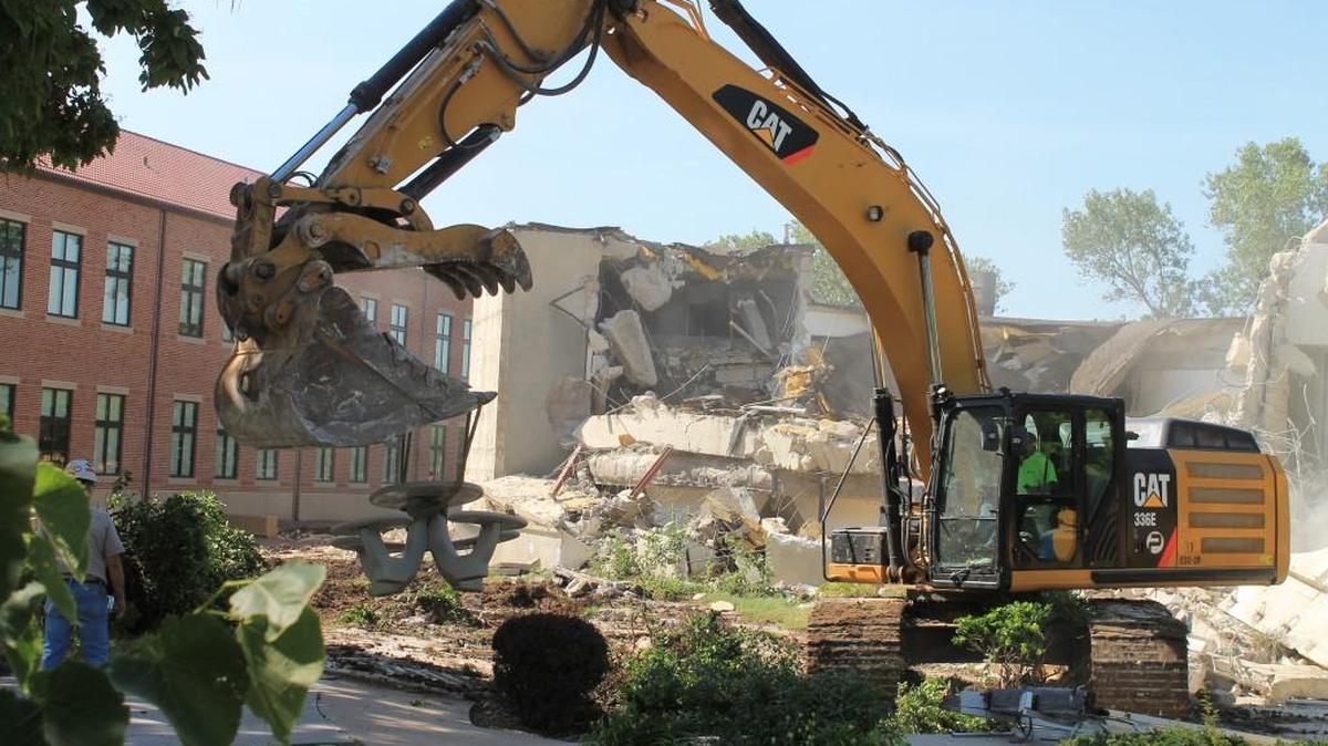 Newman University began the demolition of Heimerman Science Center, which will be replaced by the Bishop Gerber Science Center as a part of the university’s $30 million Facing Forward campaign.