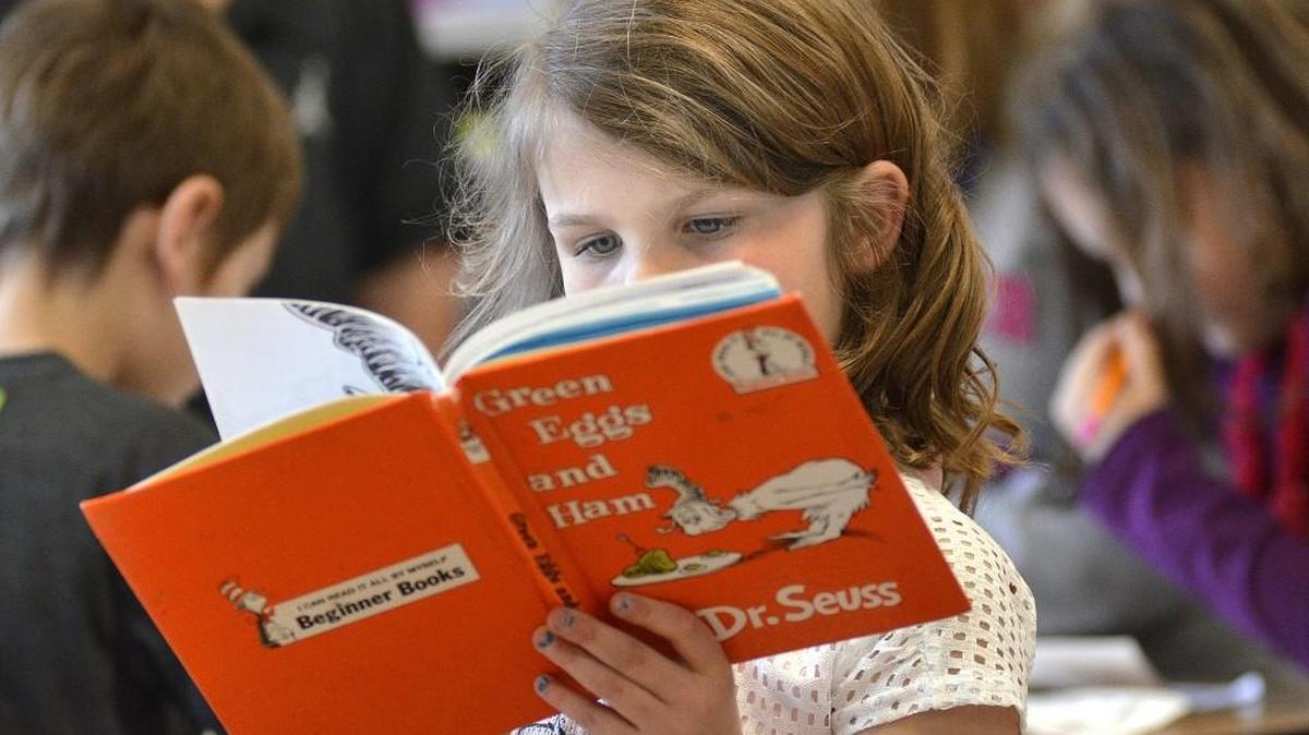 Addison Fleshman reads “Green Eggs and Ham” as students celebrate Dr. Seuss Week in Teresa Francis’ kindergarten class Monday at Westview Elementary School in Jonesboro, Ind. (Feb. 27, 2017)