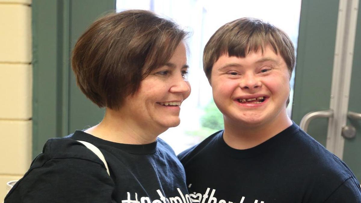 
Jolinda Kelley and her son Michael Kelley smile after the school board voted Monday to allow students who participate on Tri-County league teams to get regular varsity letters. (April 27, 2015)
