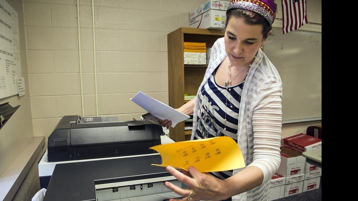 
Second grade teacher Lori Fisher uses a copy machine at West Elementary School in Valley Center. Starting this year in Valley Center, teachers have strict limits on the number of pages they can print or photocopy on school machines.
