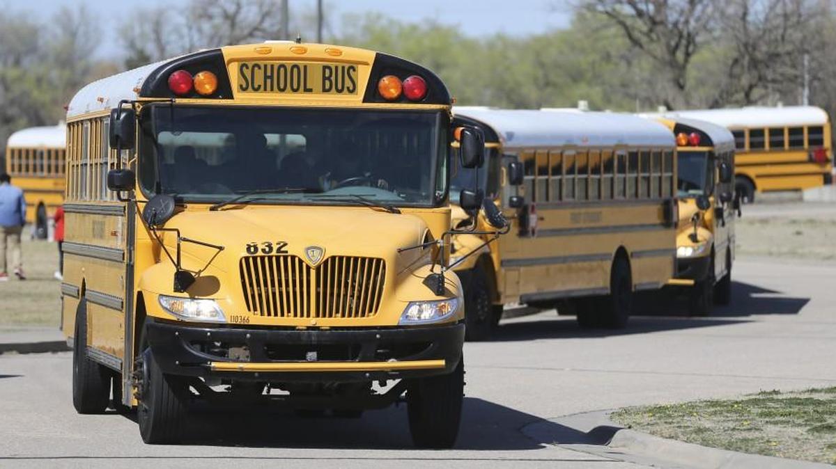 Buses filled with Stucky Middle School students leave school for the day. (March 24, 2016)