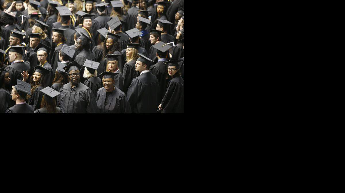 
Wichita State University graduates line up Sunday for the fall commencement at Koch Arena. (Dec. 14, 2014)
