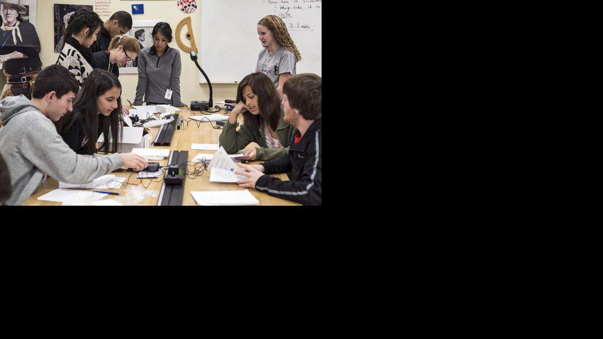 
Ryan Owen’s physics students study Newton’s Second Law during a lab at North High. (Nov. 3, 2014)
