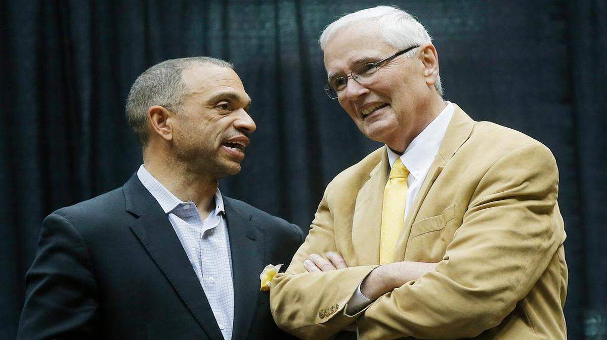 
Wichita State University athletic director Eric Sexton, left, and WSU president John Bardo talk before a public celebration for the team at Koch Arena. (April 15, 2013)
