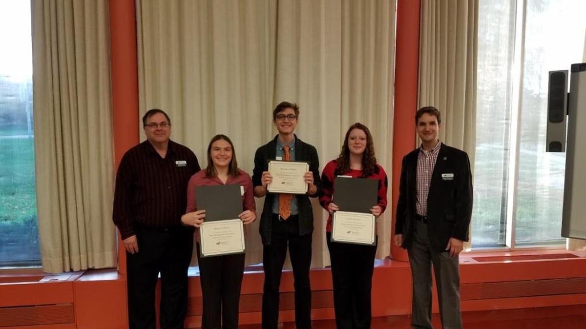 Kansas students Marina Pebley, second from left, Matthew Miller, center, and Callie Lemon, second from right, received the Klose Scholarship from Wichita State University. With them are Greg Novacek, WSU physics instructor, and Daniel Bergman of the WSU College of Education.