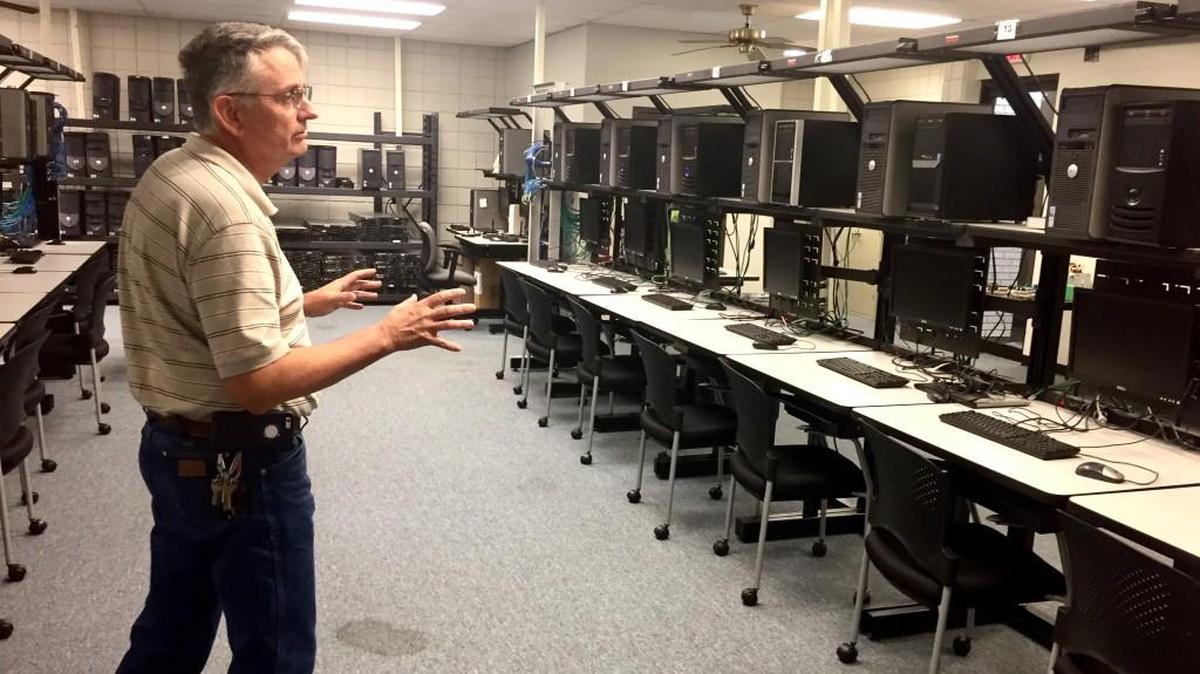Mark Angelini in one of the IT labs where he teaches at Wichita Area Technical College. He also teaches “soft skills” like appearance, attitude and communication, “because tech skills are no longer enough.”