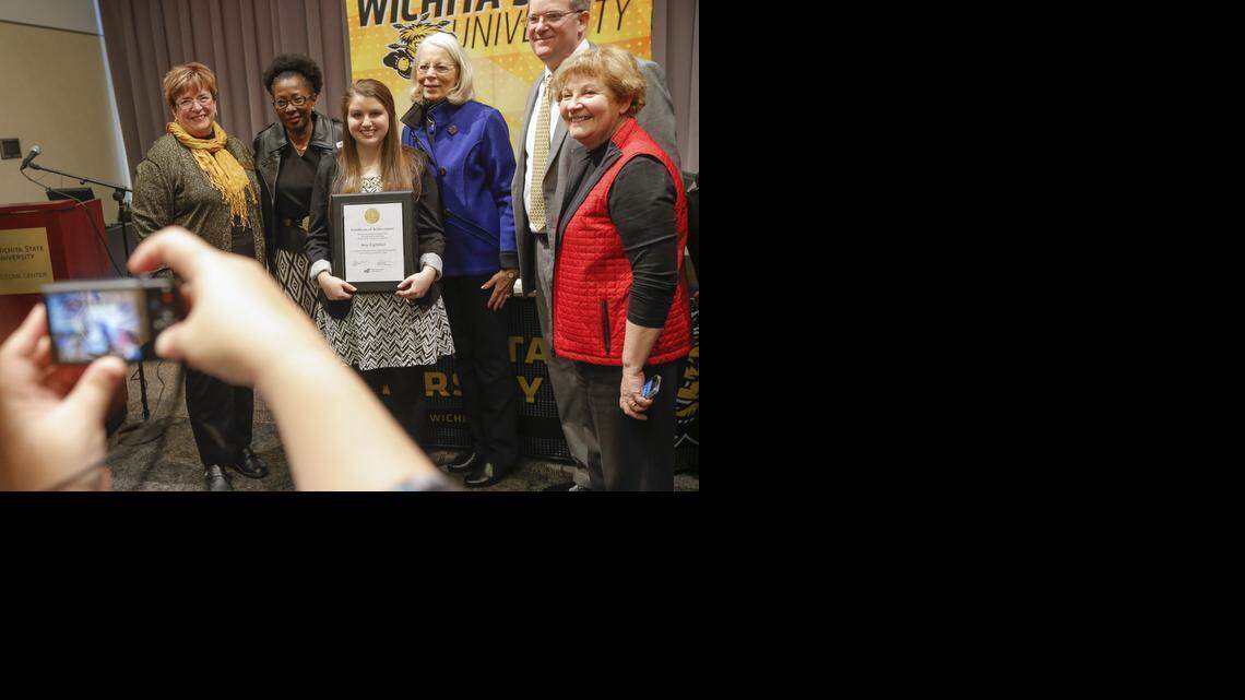 
Amy Lightfoot has her photo taken after she was announced as one of two Gore Scholars at Wichita State University on Thursday. The $52,000 Harry Gore Memorial Scholarship is among the largest undergraduate awards in Kansas. (Feb. 26, 2015)
