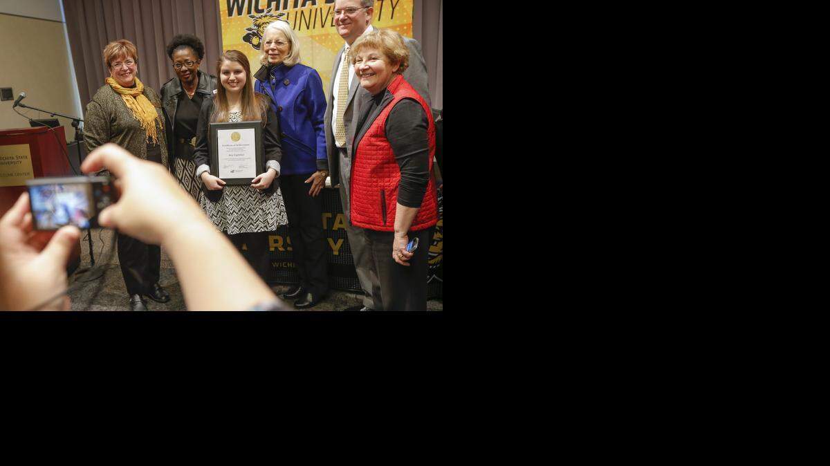 
Amy Lightfoot has her photo taken after she was announced as one of two Gore Scholars at Wichita State University on Thursday. The $52,000 Harry Gore Memorial Scholarship is among the largest undergraduate awards in Kansas. (Feb. 26, 2015)
