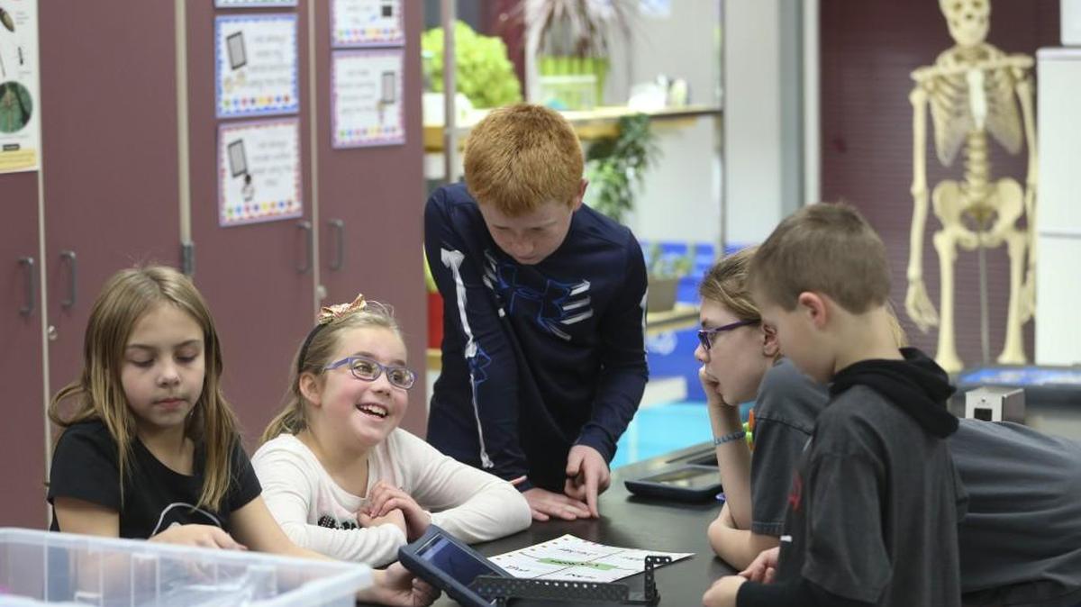 Students in Pam Cole’s fourth-grade science class at Earhart Elementary School work on a group activity as part of Project Lead the Way. (Feb. 3, 2016)