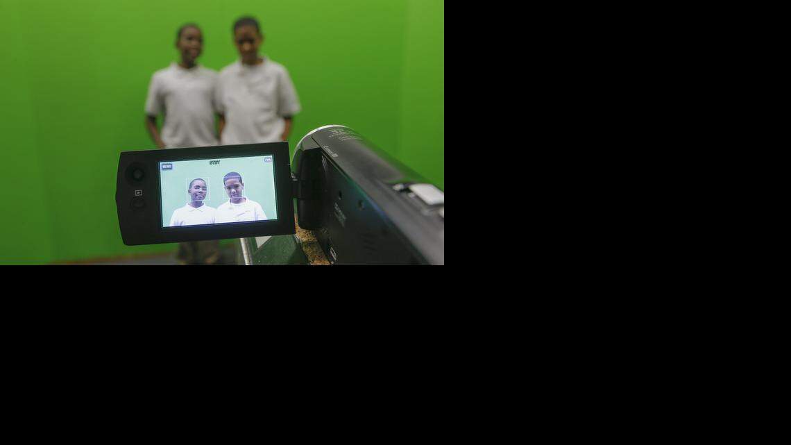 
Brooks Middle School students Kienen Walker, left, and Tomaas Wright are filmed before a green screen during a video production class at Brooks Middle School. The class is part of the school's STEM (Science, Technology, Engineering and Math) curriculum. (Feb. 13, 2014)
