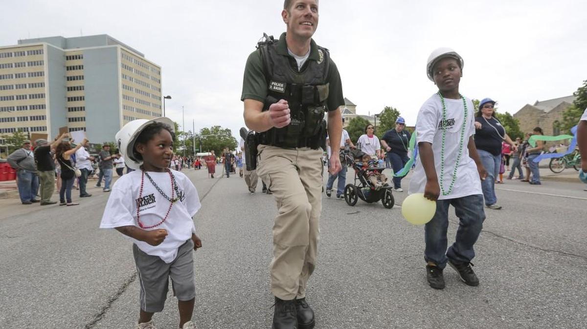Officer Tim Baird show off his dance moves during a Support Local Law Enforcement community parade in downtown Wichita.
