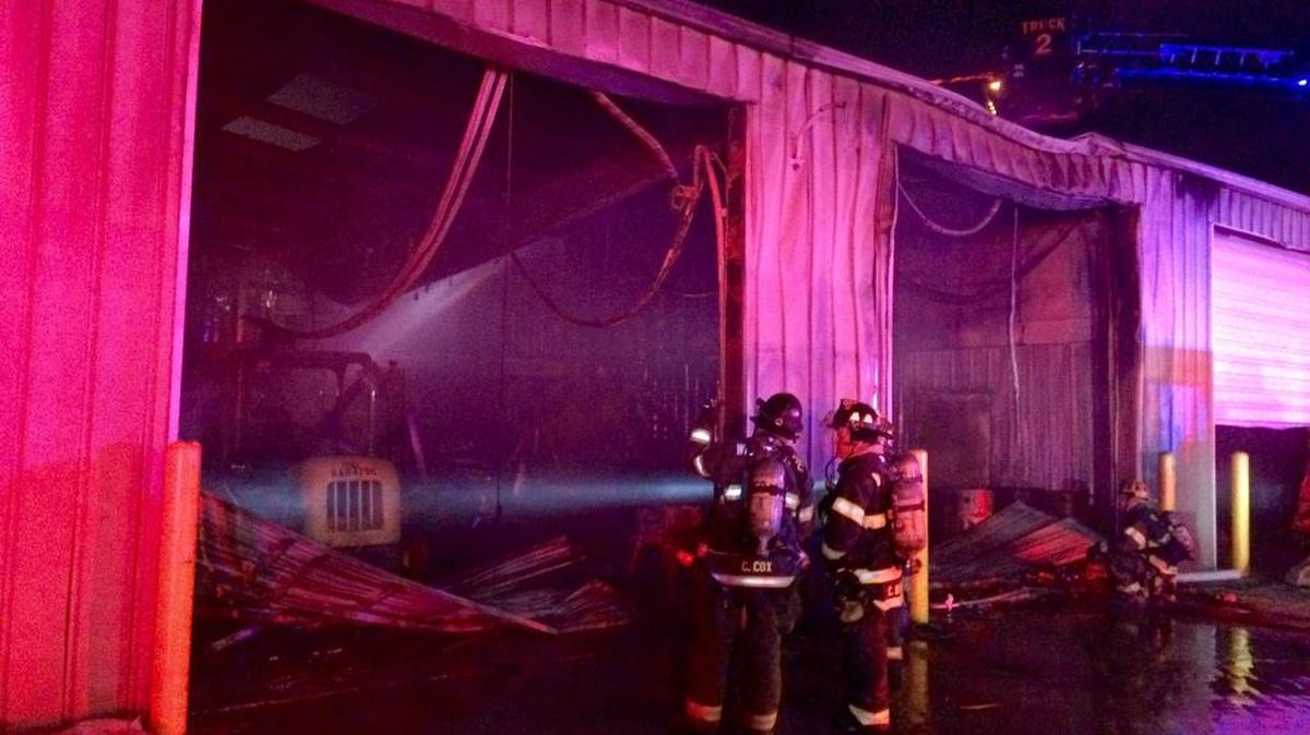 Firefighters check the interior of Diamond Engineering on West Pawnee after fire gutted a portion of the building Friday night.