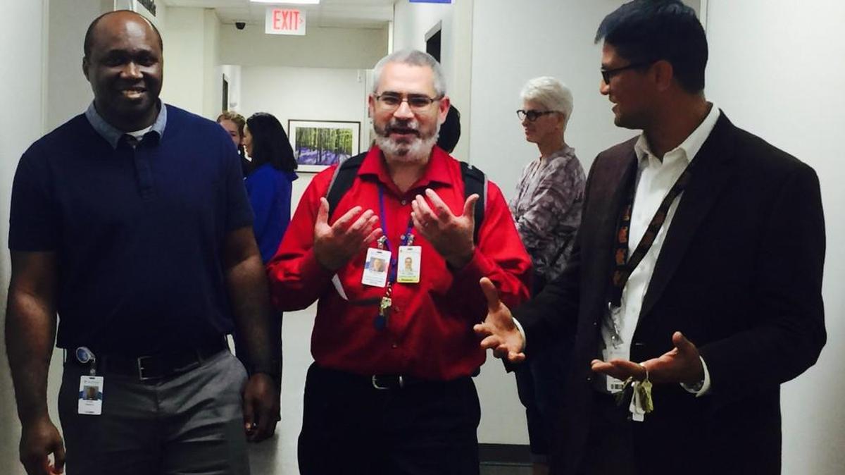 Psychiatrists Walter Kalu, Mathias Lillig, and Moneeshrinda Mittal chat during an open house Thursday after Via Christi Behavioral Health's blessing and dedication of its new outpatient space in the medical office building adjacent to Via Christi Hospital St. Joseph.
