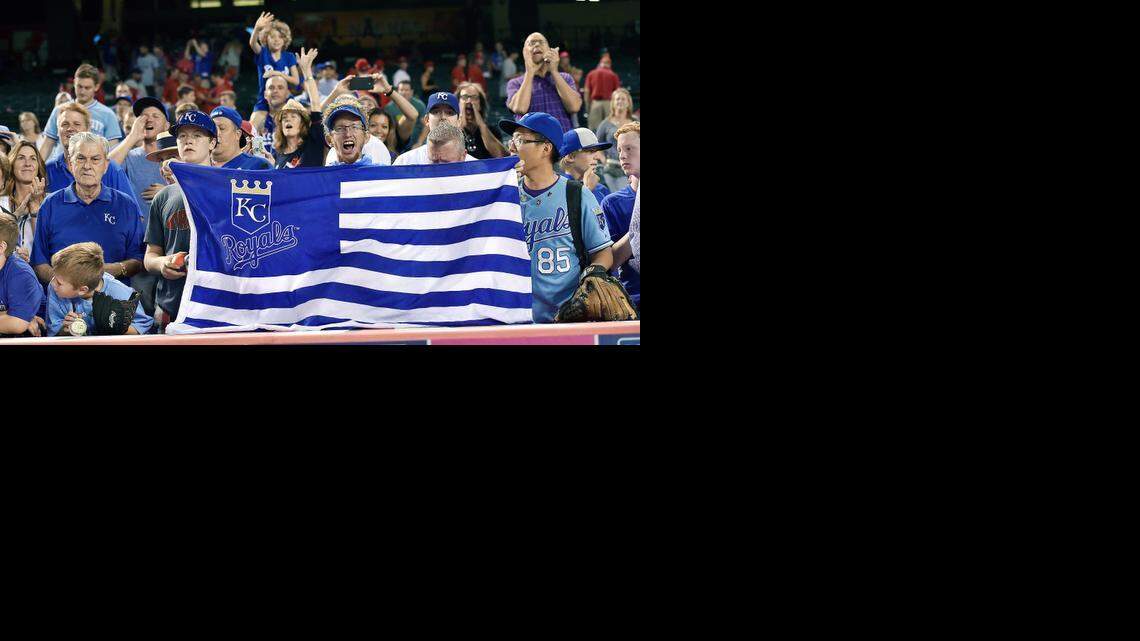 
Kansas City Royals fans celebrate with team owner David Glass, left, after the team’s 4-1 win over the Los Angeles Angels last week at Angels Stadium in Anaheim, Calif.

