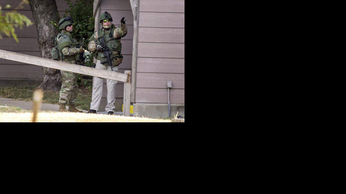 
Wichita police SWAT members gather at the scene of a stabbing that was reported at about 6 a.m. at Longfellow Apartments, 1212 S. Longfellow. (Sept. 15, 2014)
