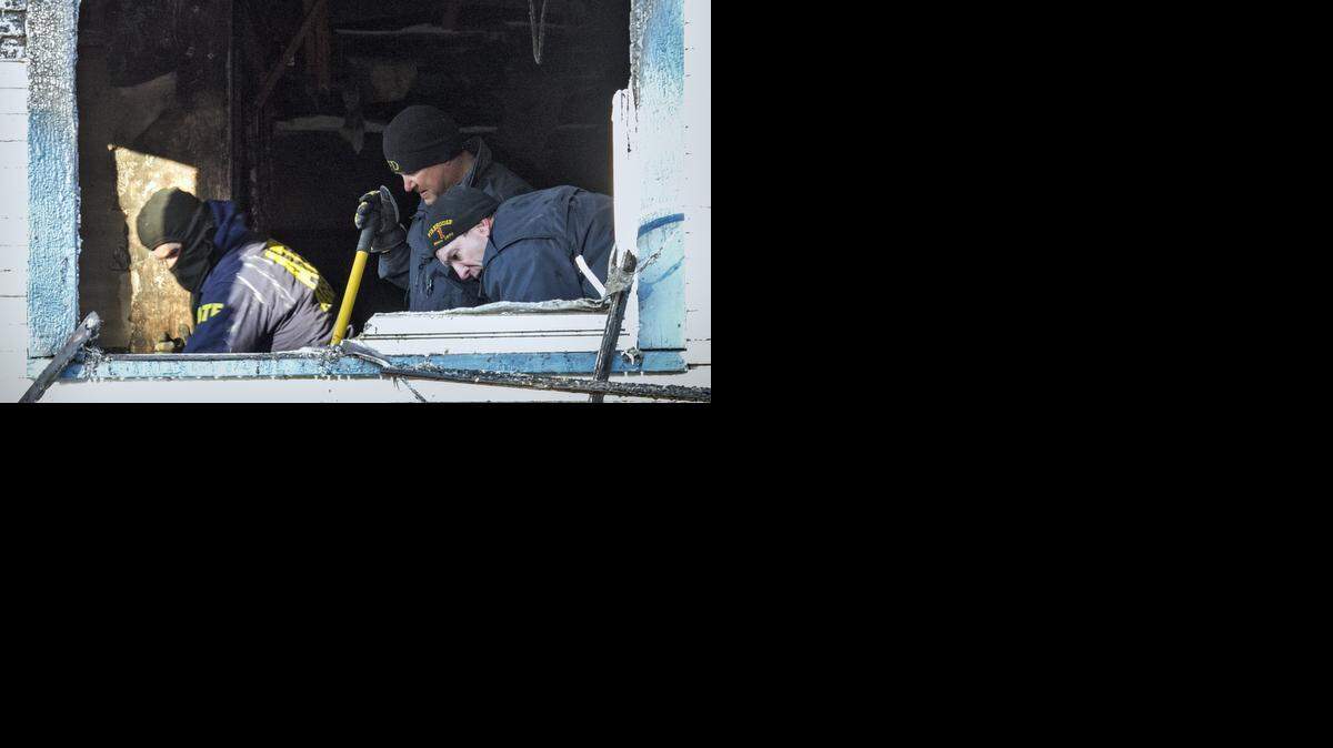 
Investigators work to determine the cause of an early morning fire in the 1300 block of South Water, where a 9-year-old boy died and two other people were seriously injured. (Nov. 12, 2014)

