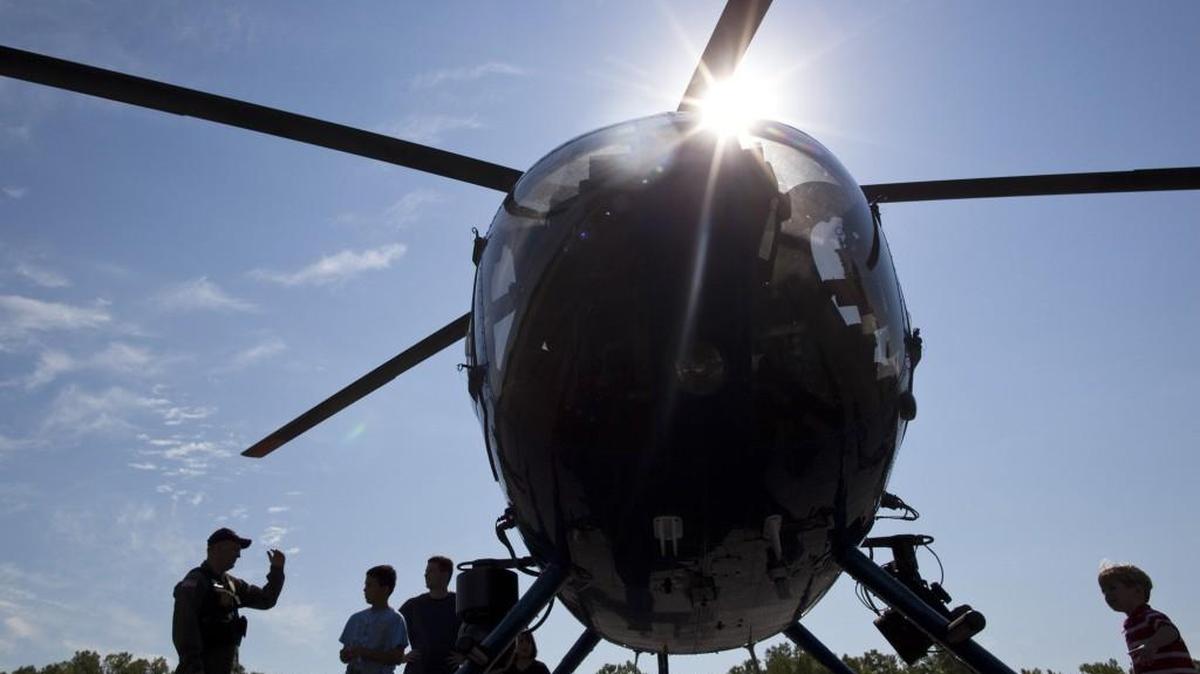Pilot Dave Dolieslager talks about the Wichita Police Department helicopter during the Law Enforcement Expo at the Sedgwick County Extension Office. (Sept. 10, 2011)