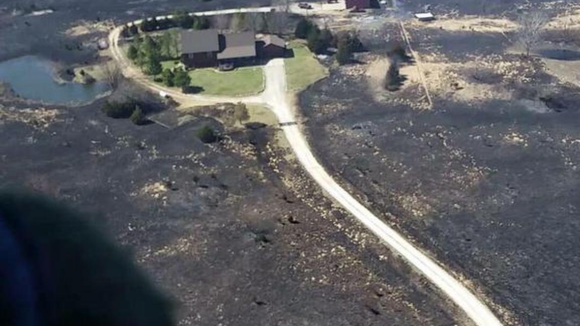 This photo taken by the Kansas Air National Guard shows the home of Scott and Danielle Tajchman north of Hutchinson. Danielle Tajchman said two volunteer Riley County firefighters helped save the house.