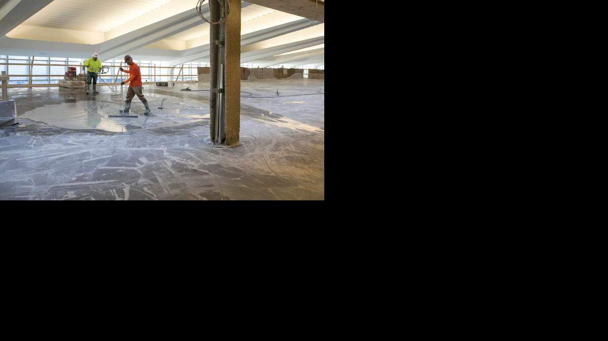 
Workers polish aggregate flooring on the mezzanine level as construction continues at the new Dwight D. Eisenhower National Airport terminal. (Feb. 12, 2015)
