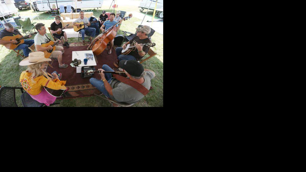 
A bluegrass jam session Tuesday at the Colby Camp at the Walnut Valley Festival included members of headliners Driven and the Cherokee Maidens. (September 16, 2014) 
