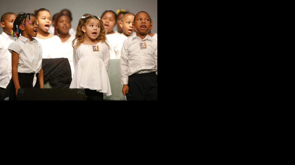 
A children’s choir sings during the annual Martin Luther King Jr. Day celebration at Wichita State University’s Hughes Metroplex in 2014. (Jan. 20, 2014)
