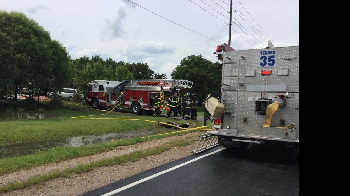 
Rescuers responded to a house fire on South 199th Street West near West Kellogg Drive. The fire started when lightning struck the roof Monday afternoon. (May 25, 2015)
