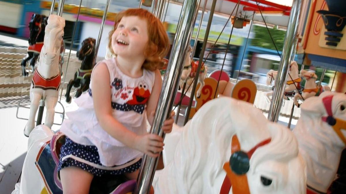 A child takes a spin on the carousel at Joyland in 2006.