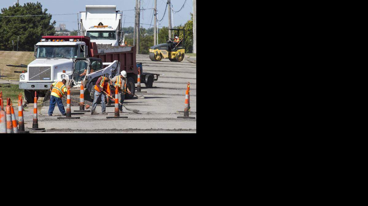 
A Barkley Construction crew repairs thermal cracks on 35th Street North near Webb Road last week as part of the city’s ongoing contract maintenance work. Thermal cracks are an inch or two wide and run from curb to curb. They develop from the cycling of hot and cold temperatures over several years. (Sept. 22, 2014)
