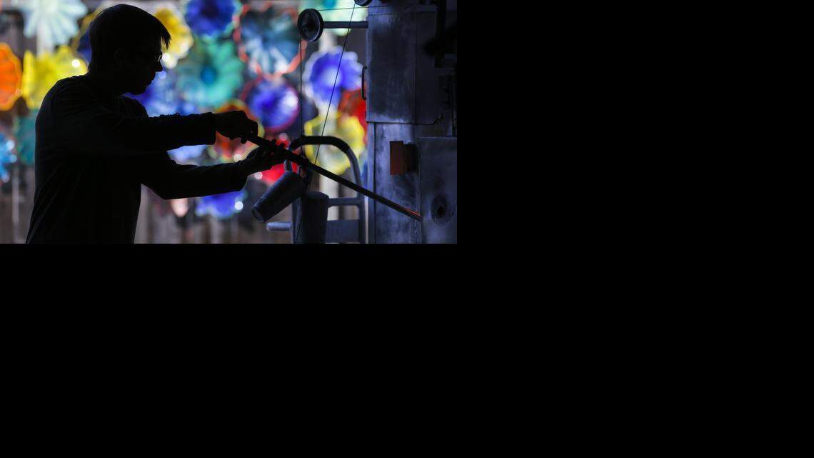 
Glassblower Scott Garrelts pulls molten glass from a furnace onto a blowpipe during an ornament-blowing event at Karg Art Glass in Kechi on Saturday. Customers, with the assistance of glassblowers, could make their own Christmas ornaments at the store.
