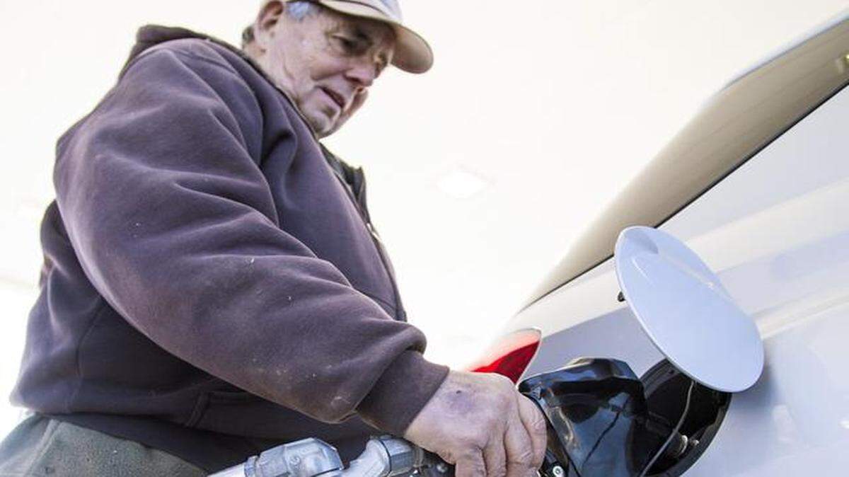 Richard Peter fills his tank at a Kwik Shop at 21st and Amidon. Gas prices are dropping, though Wichita still has higher prices than most other Kansas cities.