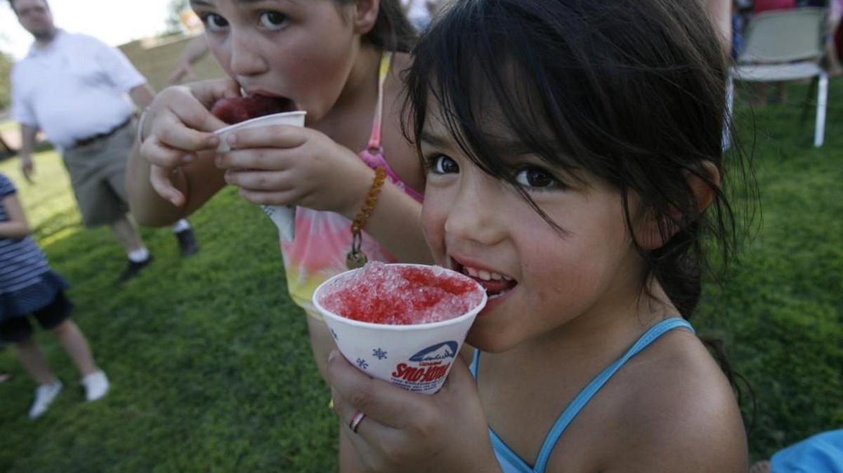 Yasmin Aldaba, 6, right, and Veronica Gallegos, 10, enjoy a cool treat during National Night Out at Lincoln Park in 2011.