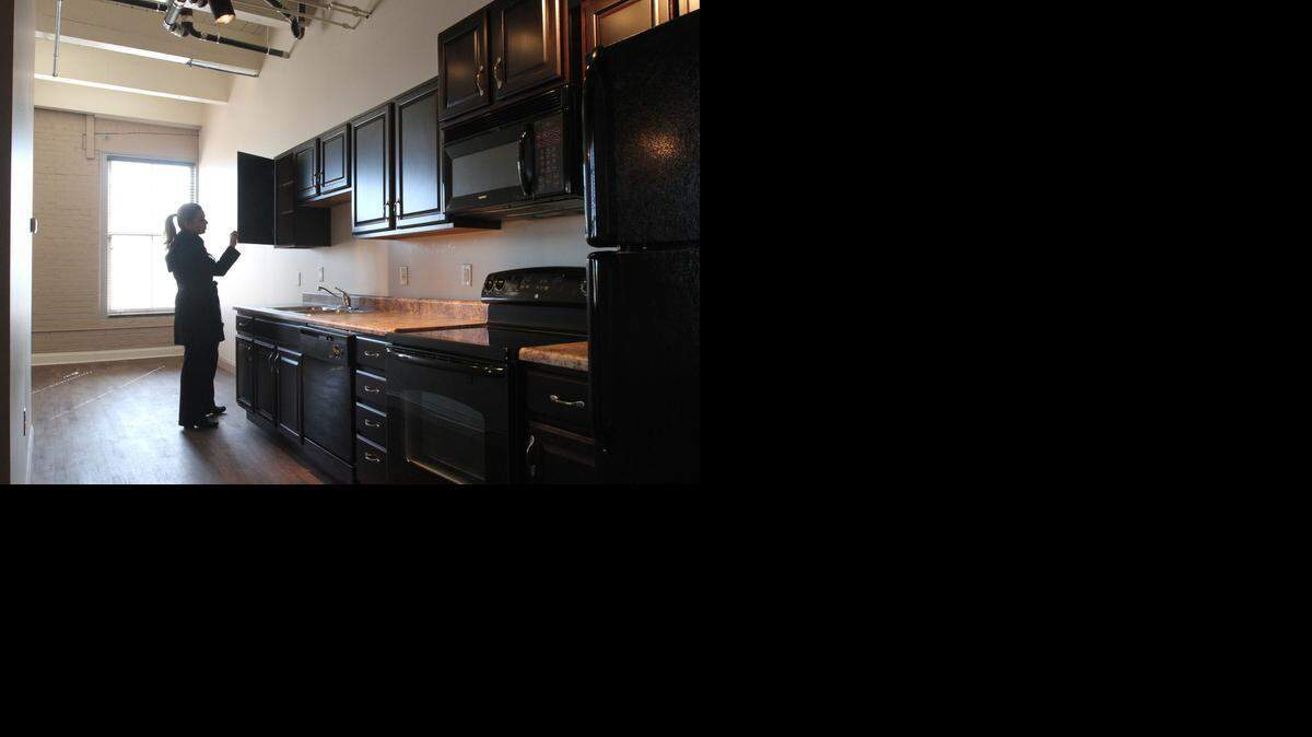 
A visitor checks out the kitchen area in one of the two-bedroom Player Piano Lofts units. (Feb. 14, 2014)
