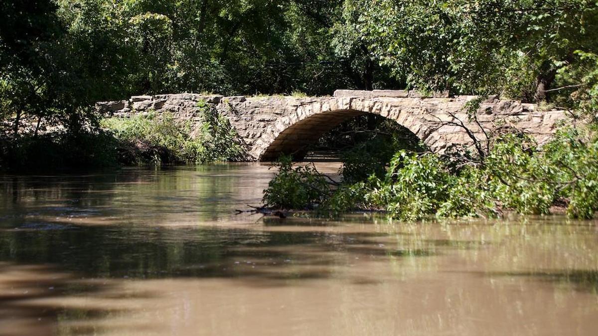 Polecat Creek Bridge in Butler County, which was damaged in recent floods, was a popular place to swim some decades ago.