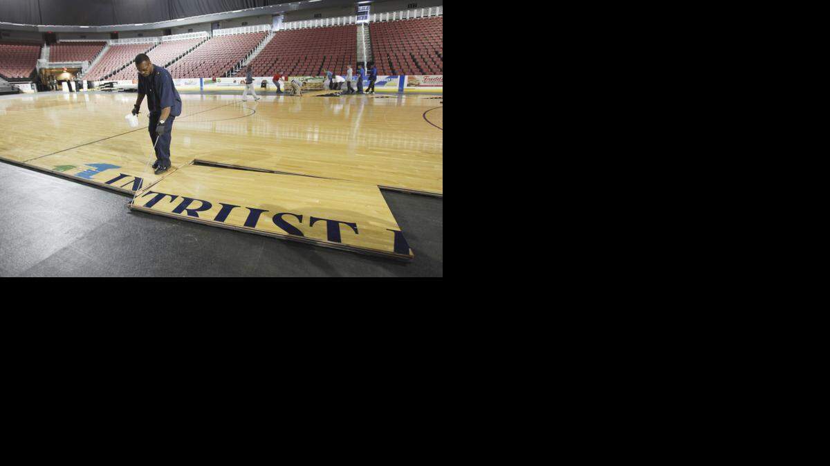 
Workers at Intrust Bank Arena lay out the basketball court in preparation of the first and second rounds of the NCAA Wichita Women's Regional in 2011.
