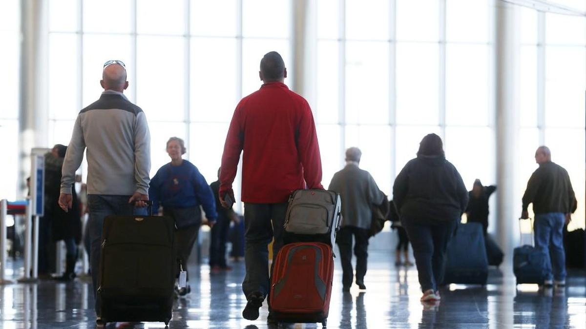 Travelers pass Wednesday near the check-in area at Wichita Eisenhower National Airport. (Nov. 18, 2015)