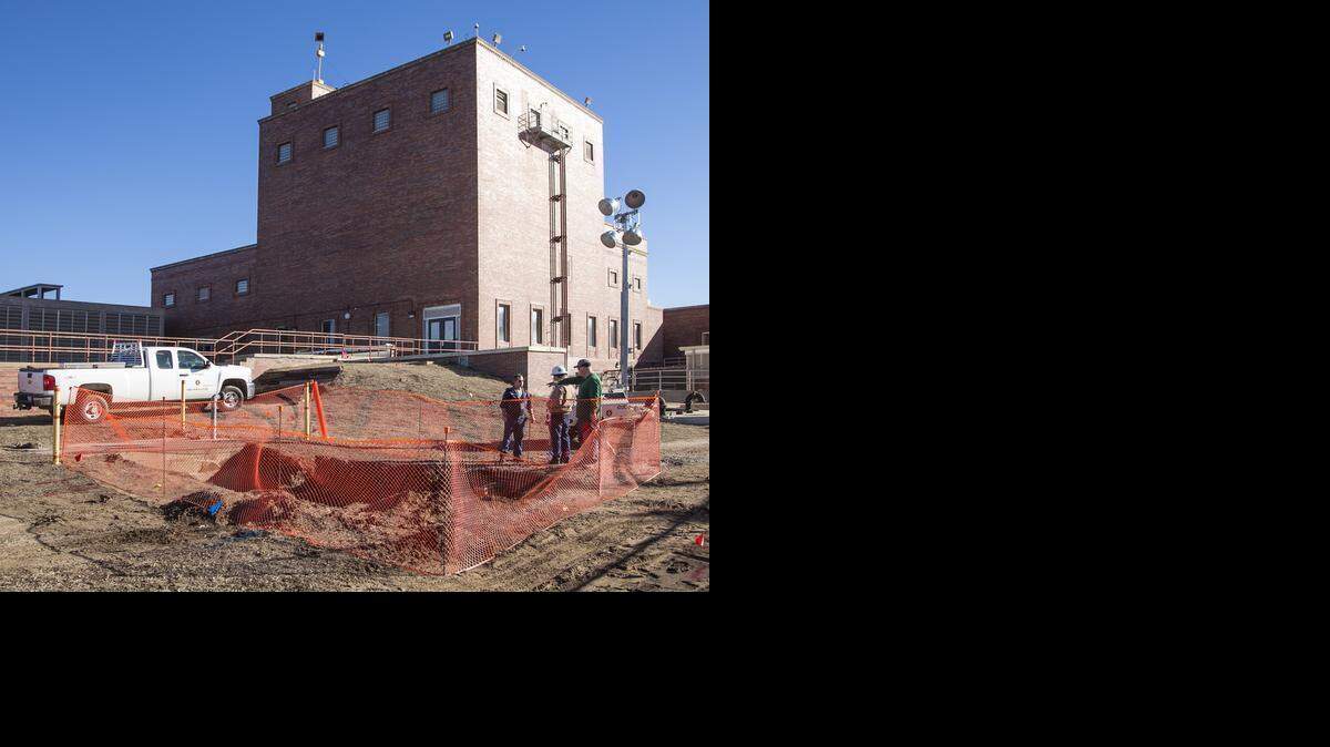 
Wichita public works employees survey the scene where a water leak is being repaired at the water treatment plant near Botanica. (Jan. 23, 2015)
