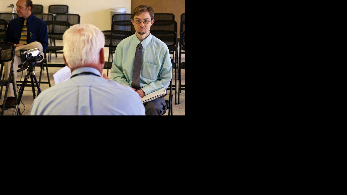 
Andrew McKinney, right, works with TeamUp Careers volunteer Jeff Donham in a videotaped mock job interview in 2011.

