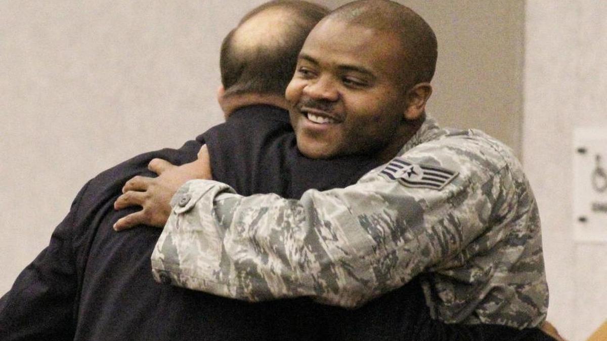 
Staff Sgt. Joseph Hubbard, right, embraces retired Capt. Guy Gruters after his speech at McConnell Air Force Base on Wednesday. Hubbard said that after talking to Gruters all morning, he felt a “spiritual connection” with him. 

