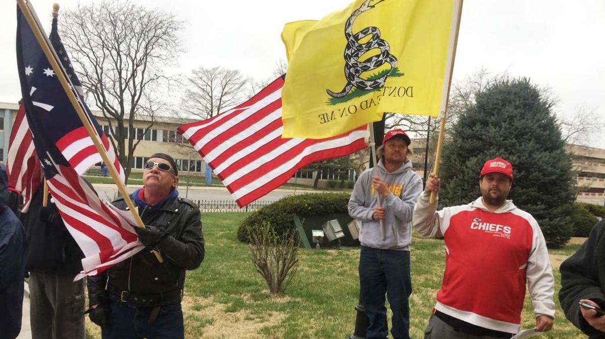 Jack Williams, left, his son Jesse Williams, center, and Justin Lauderdale rallied with others on Saturday to support President Trump. “He’s an everyday American, like us,” Jack Williams said. “The Washington politicians don’t know how to handle him.”