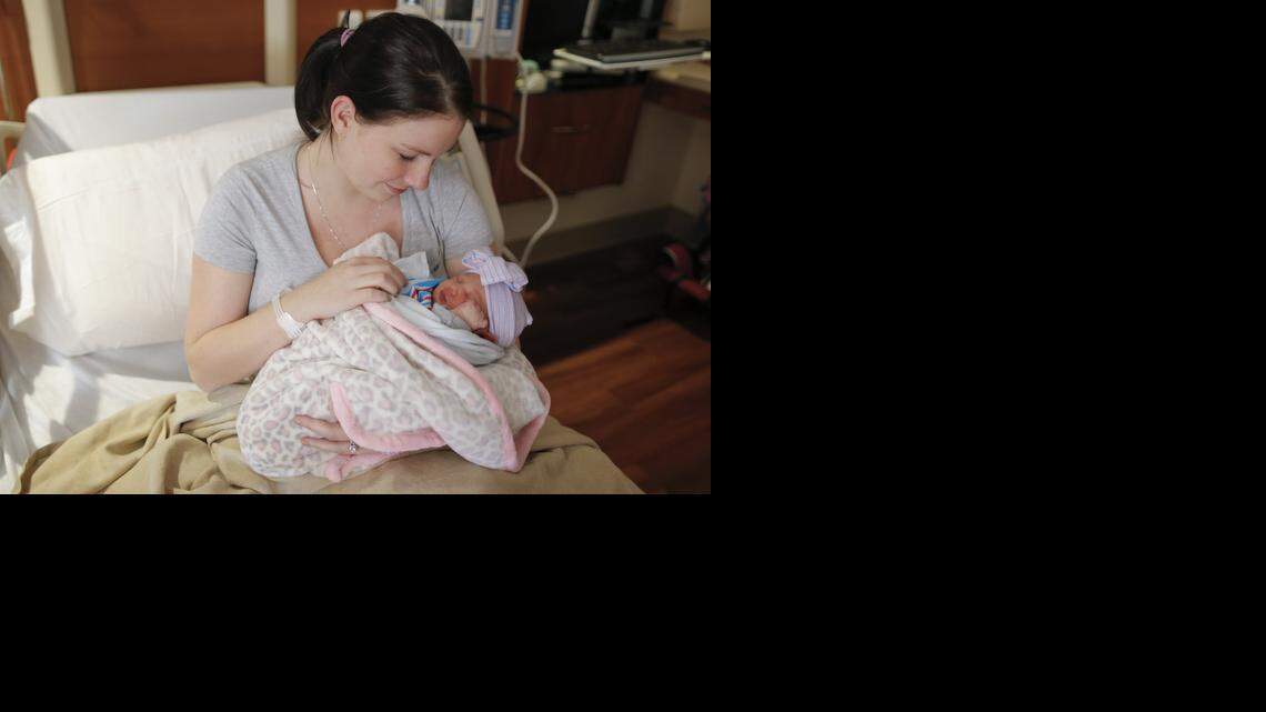 
Kristena Hawken holds her day-old daughter Autumn Meister at Wesley Medical Center on Thursday. The latest data show that Kansas birth rates for 2013 were the lowest since record keeping began in 1912. That’s in line with the national trend as well. 
