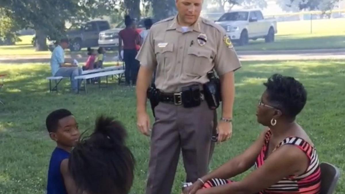Wichita police Chief Gordon Ramsay talks with people during the First Steps Community Cookout at McAdams Park. (July 18, 2016)
